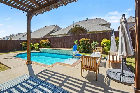 a view of a patio with a table chairs and a patio
