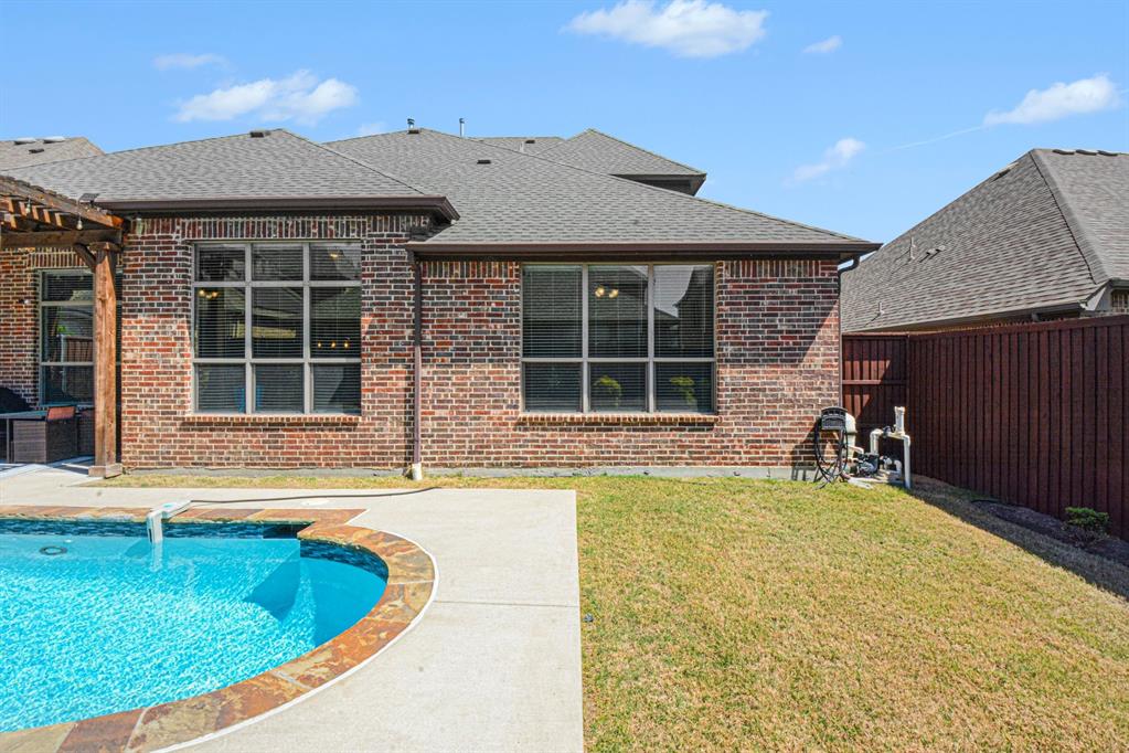 3323 Royal Ridge Drive Rockwall, TX 75087 - Photo 33 of 37 a front view of a house with swimming pool and porch
