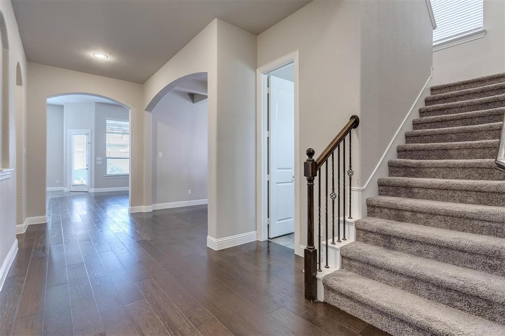 3323 Royal Ridge Drive Rockwall, TX 75087 - Photo 8 of 37 a view of an entryway with wooden floor