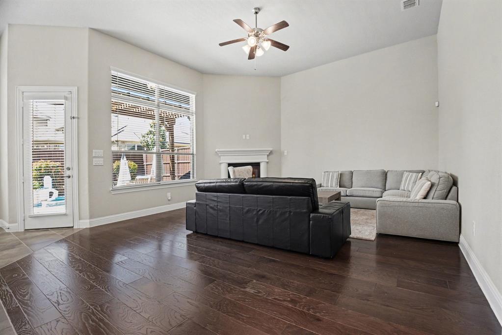 3323 Royal Ridge Drive Rockwall, TX 75087 - Photo 10 of 37 a living room with furniture and a large window