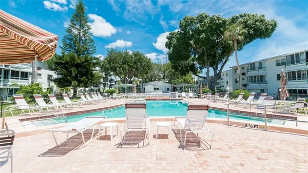 a view of a swimming pool with a patio