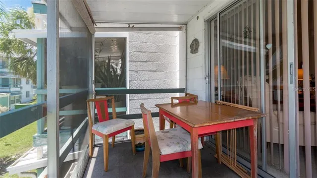 a backyard of a house with outdoor seating