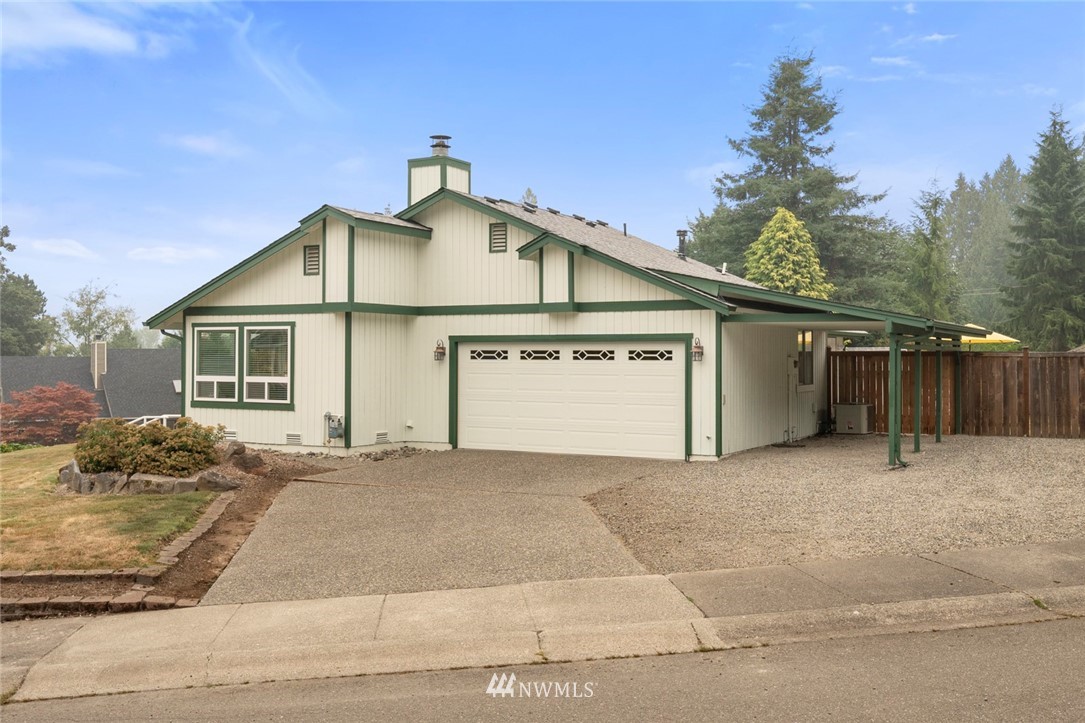 23513 22nd Avenue Southeast Bothell, WA 98021 - Photo 2 of 33 a view of a house with a yard and garage