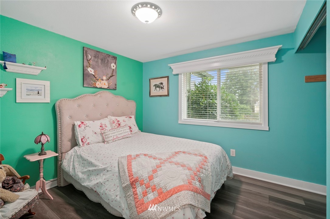 23513 22nd Avenue Southeast Bothell, WA 98021 - Photo 12 of 33 a bedroom with a bed and a window