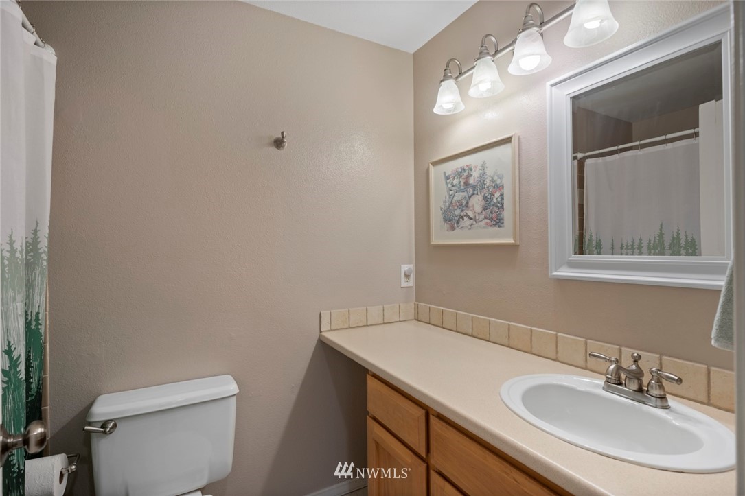 23513 22nd Avenue Southeast Bothell, WA 98021 - Photo 14 of 33 a bathroom with a sink vanity and toilet