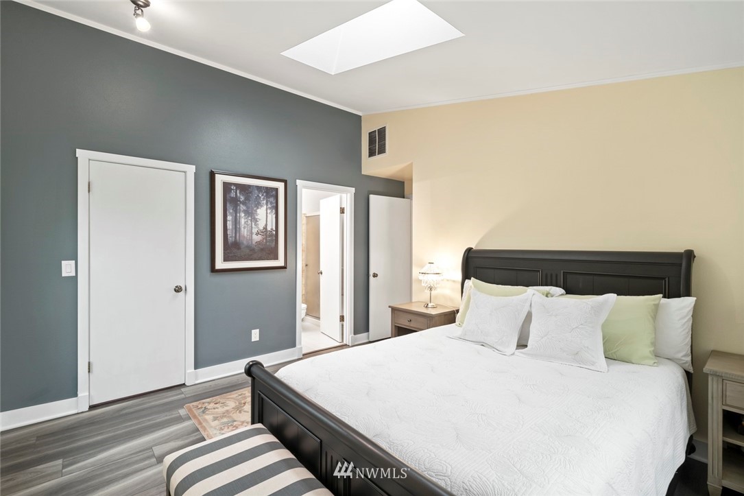 23513 22nd Avenue Southeast Bothell, WA 98021 - Photo 15 of 33 a bedroom with bed and wooden floor