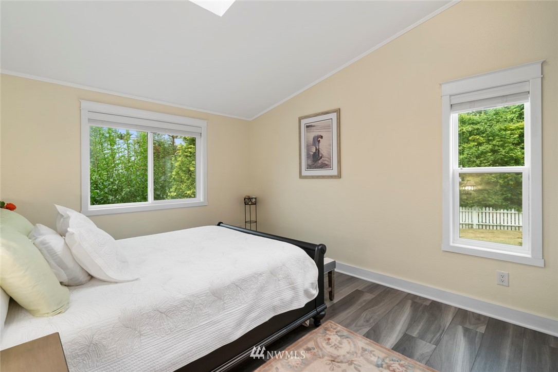 23513 22nd Avenue Southeast Bothell, WA 98021 - Photo 16 of 33 a bedroom with a bed and a window