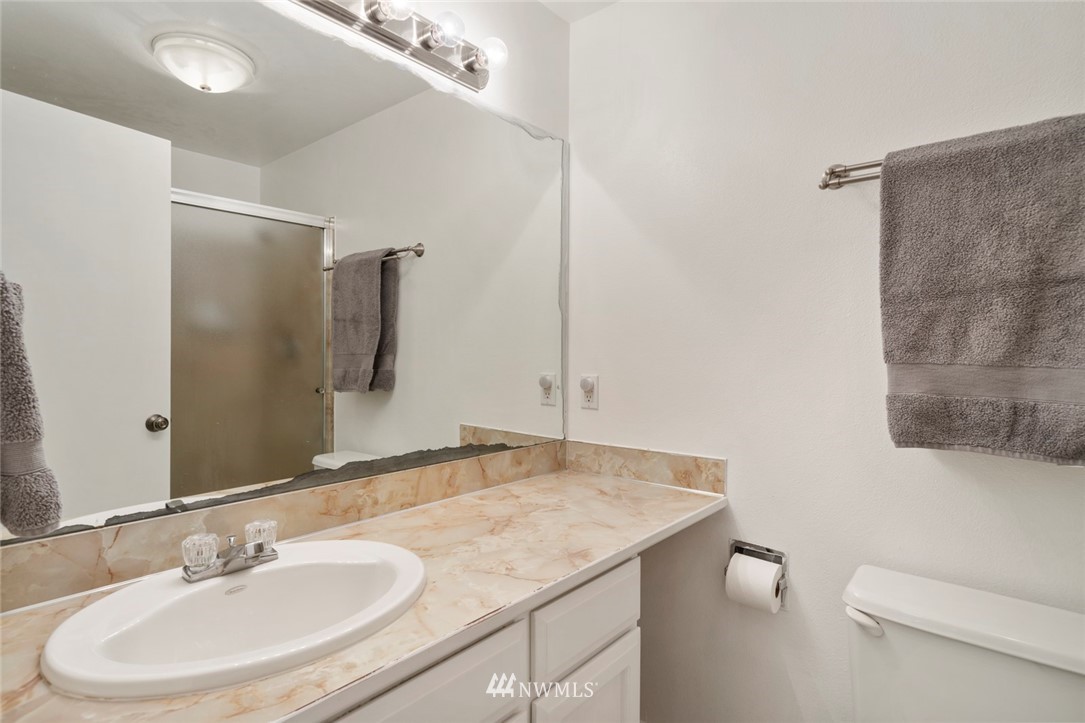 23513 22nd Avenue Southeast Bothell, WA 98021 - Photo 17 of 33 a bathroom with a sink toilet and shower