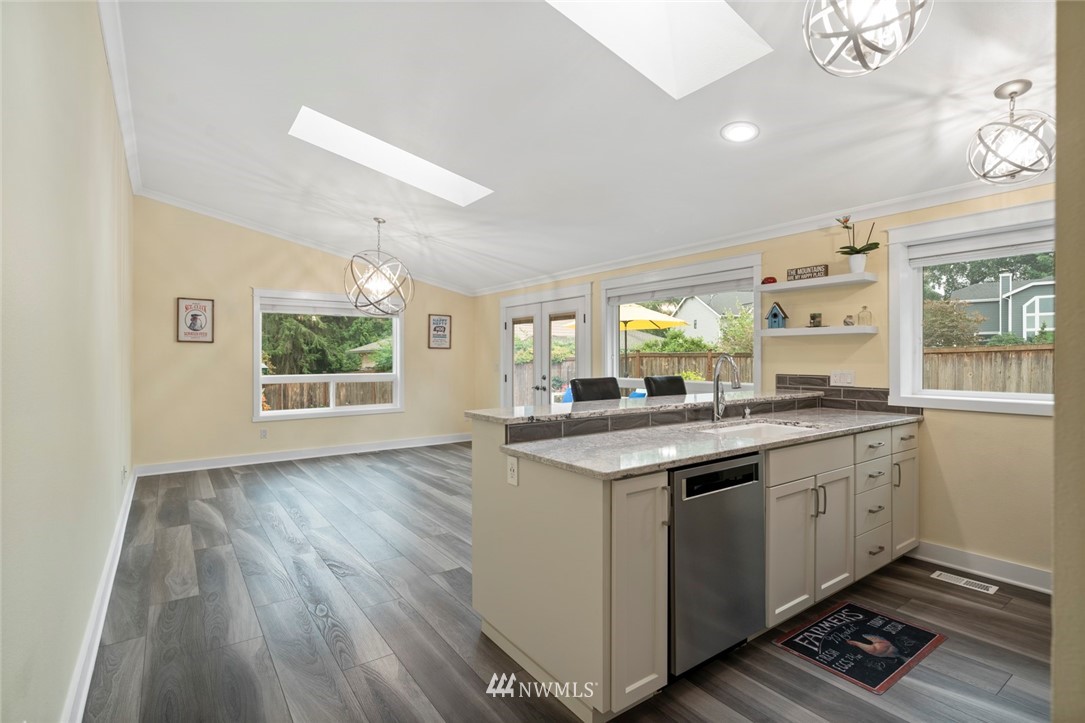 23513 22nd Avenue Southeast Bothell, WA 98021 - Photo 18 of 33 a kitchen with a sink and wooden floor
