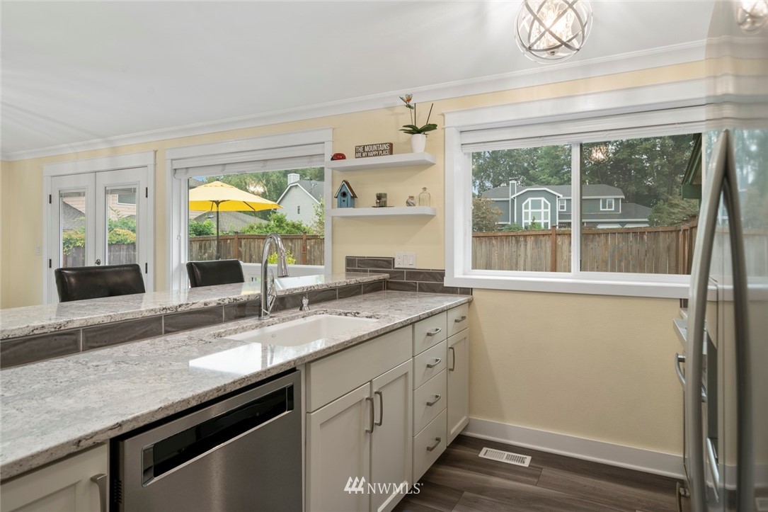 23513 22nd Avenue Southeast Bothell, WA 98021 - Photo 21 of 33 a kitchen with a sink and large window