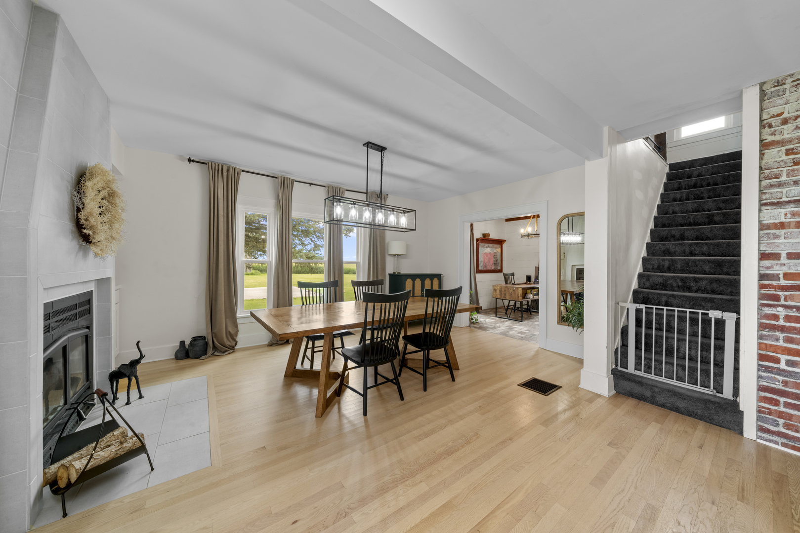 3705 Elva Road Malta, IL 60150 - Photo 15 of 42 a dining room with furniture entryway and wooden floor