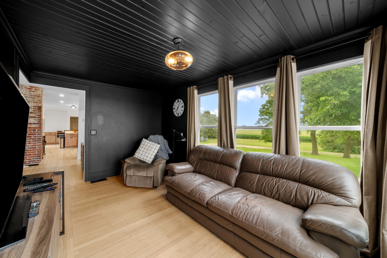 3705 Elva Road Malta, IL 60150 - Photo 17 of 42 a living room with furniture and a large window