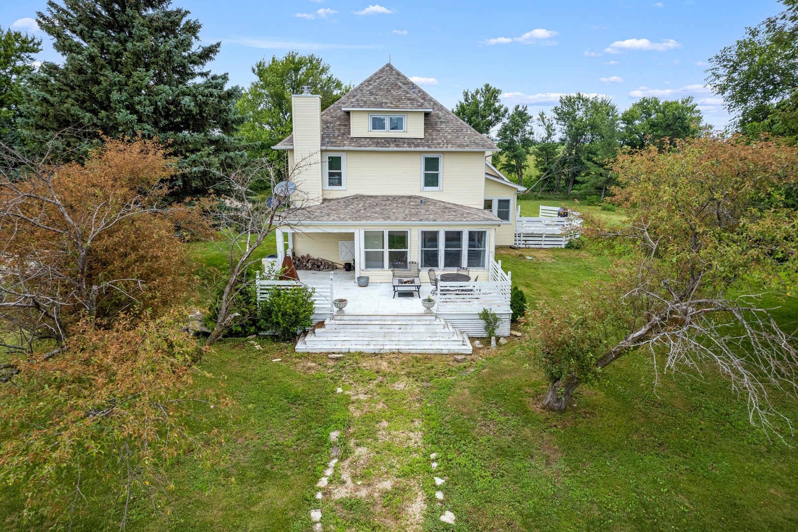 3705 Elva Road Malta, IL 60150 - Photo 2 of 42 a front view of a house with yard and green space