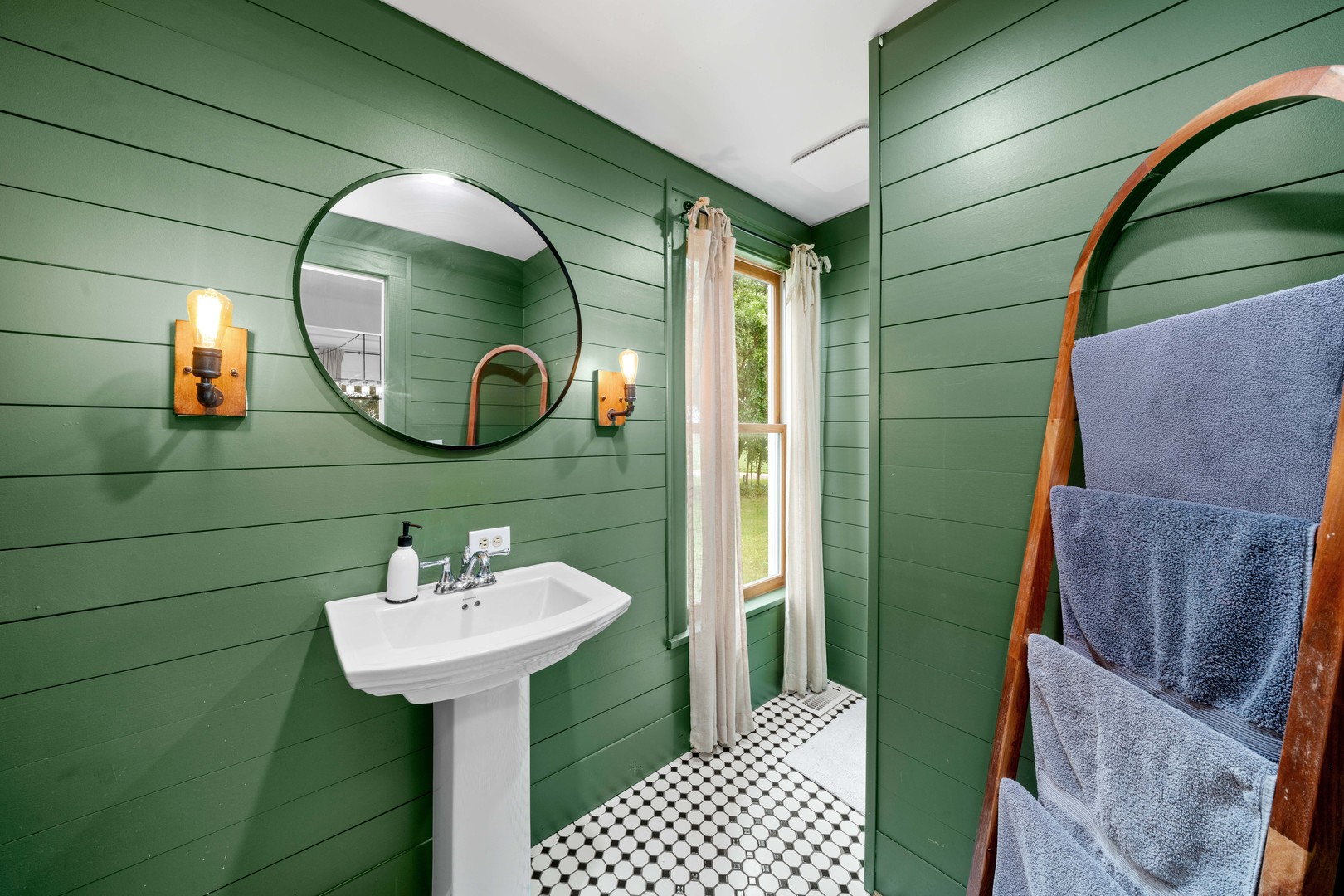 3705 Elva Road Malta, IL 60150 - Photo 23 of 42 a bathroom with a sink and mirror