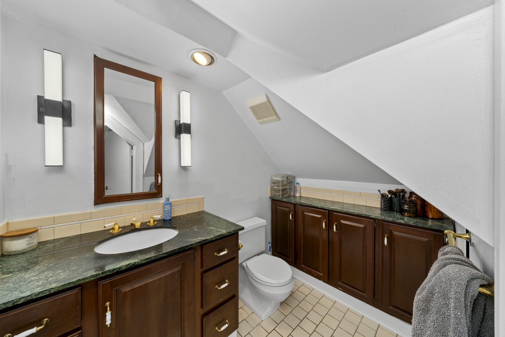 3705 Elva Road Malta, IL 60150 - Photo 26 of 42 a bathroom with a granite countertop sink toilet and mirror