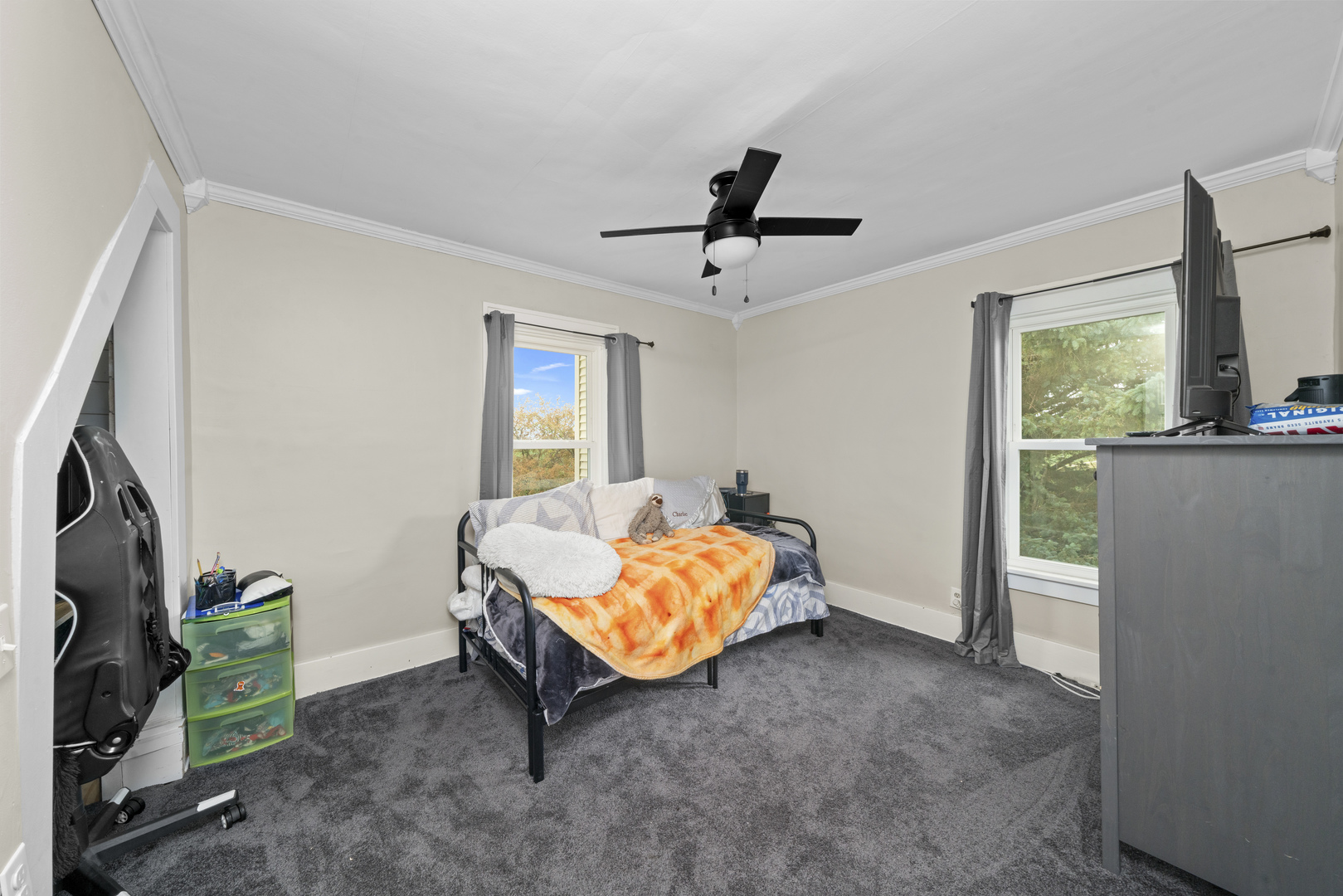 3705 Elva Road Malta, IL 60150 - Photo 32 of 42 a living room with furniture and a flat screen tv