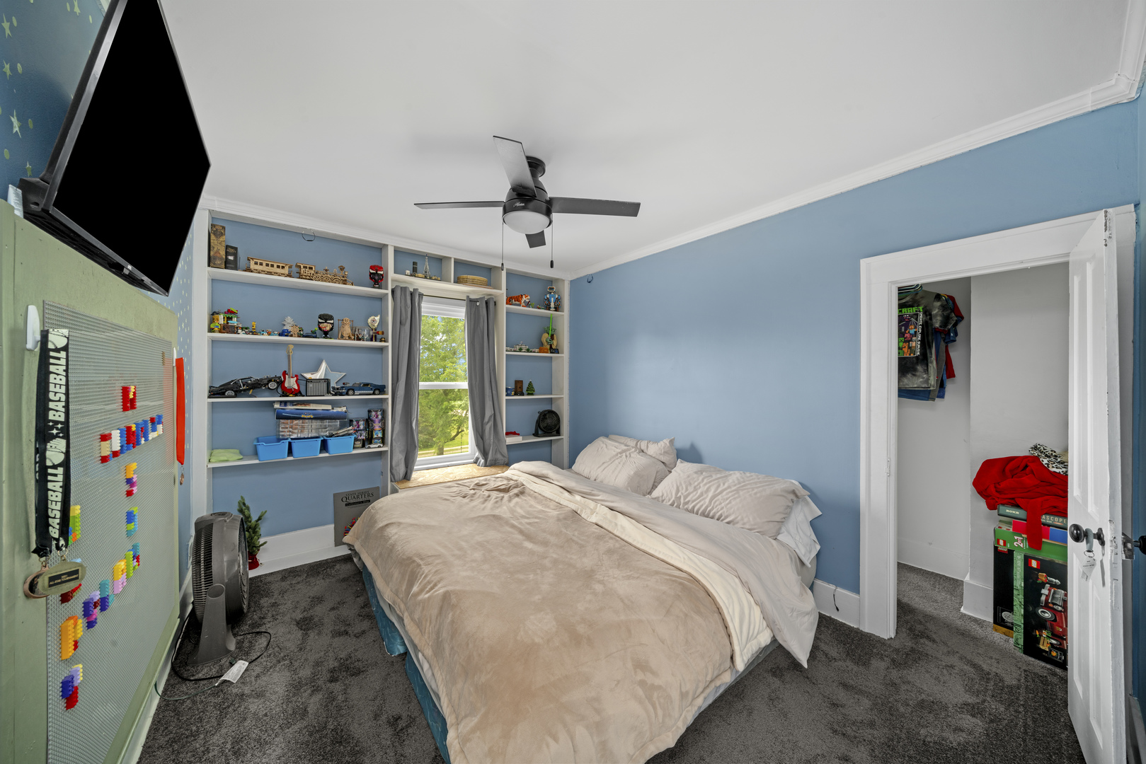 3705 Elva Road Malta, IL 60150 - Photo 34 of 42 a bedroom with a bed and a walk in closet