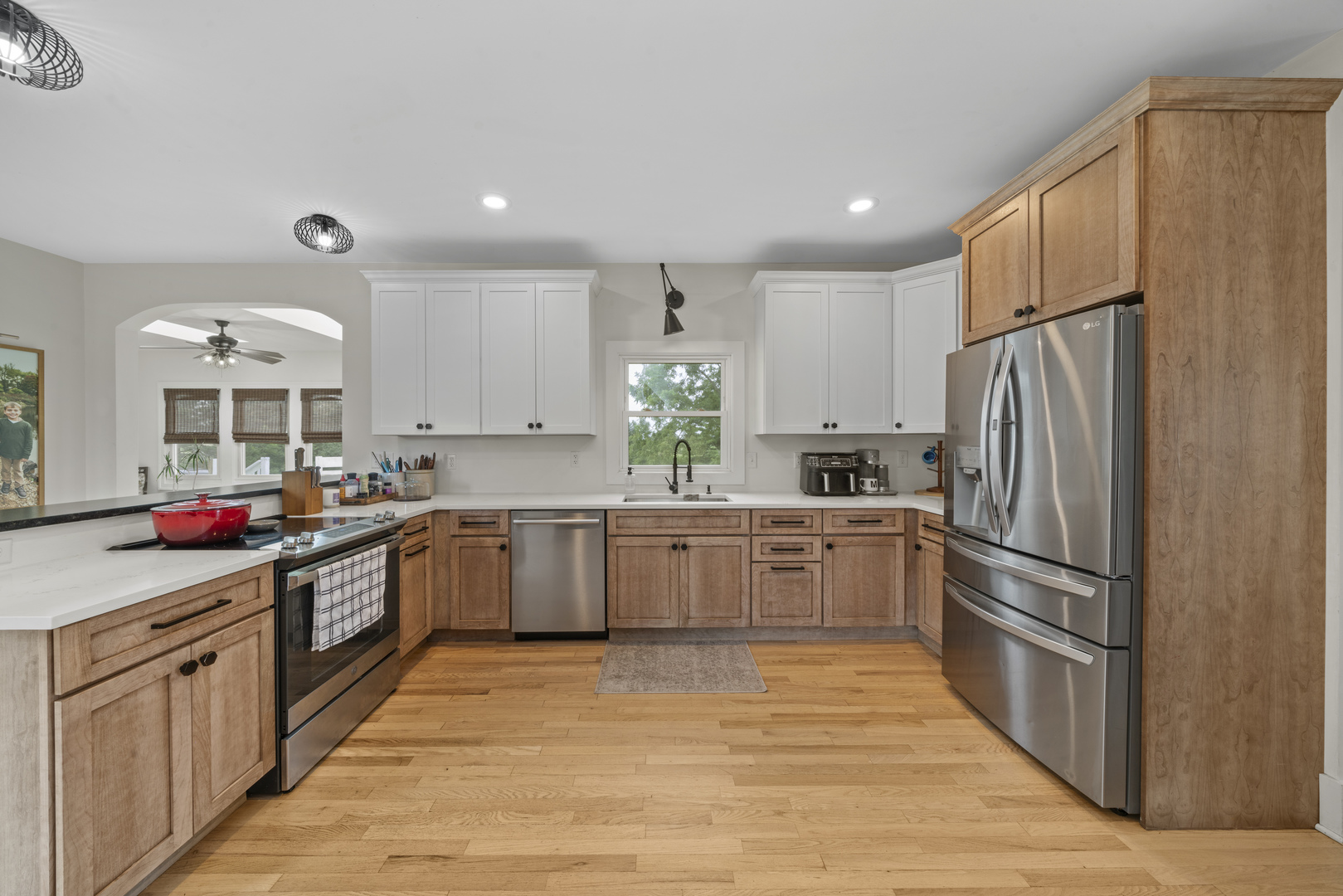 3705 Elva Road Malta, IL 60150 - Photo 10 of 42 a large kitchen with stainless steel appliances granite countertop a refrigerator and a stove top oven