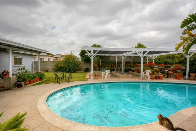 a view of a swimming pool with a sitting space