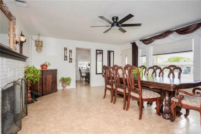 a kitchen with stainless steel appliances a stove a table and chairs