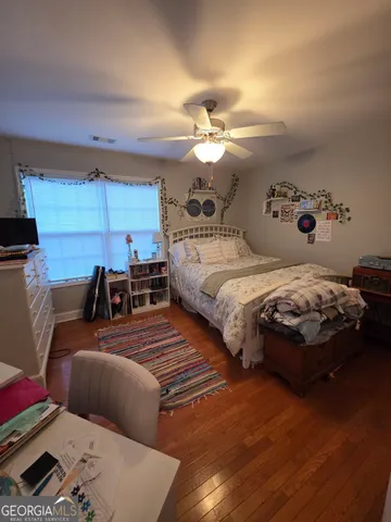 a bedroom with double bed and a couch