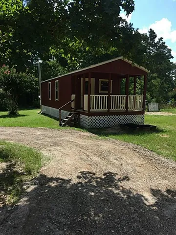 a view of a deck with a yard
