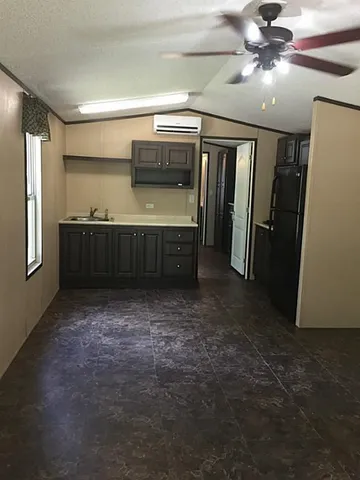 a kitchen with stainless steel appliances a refrigerator and a stove