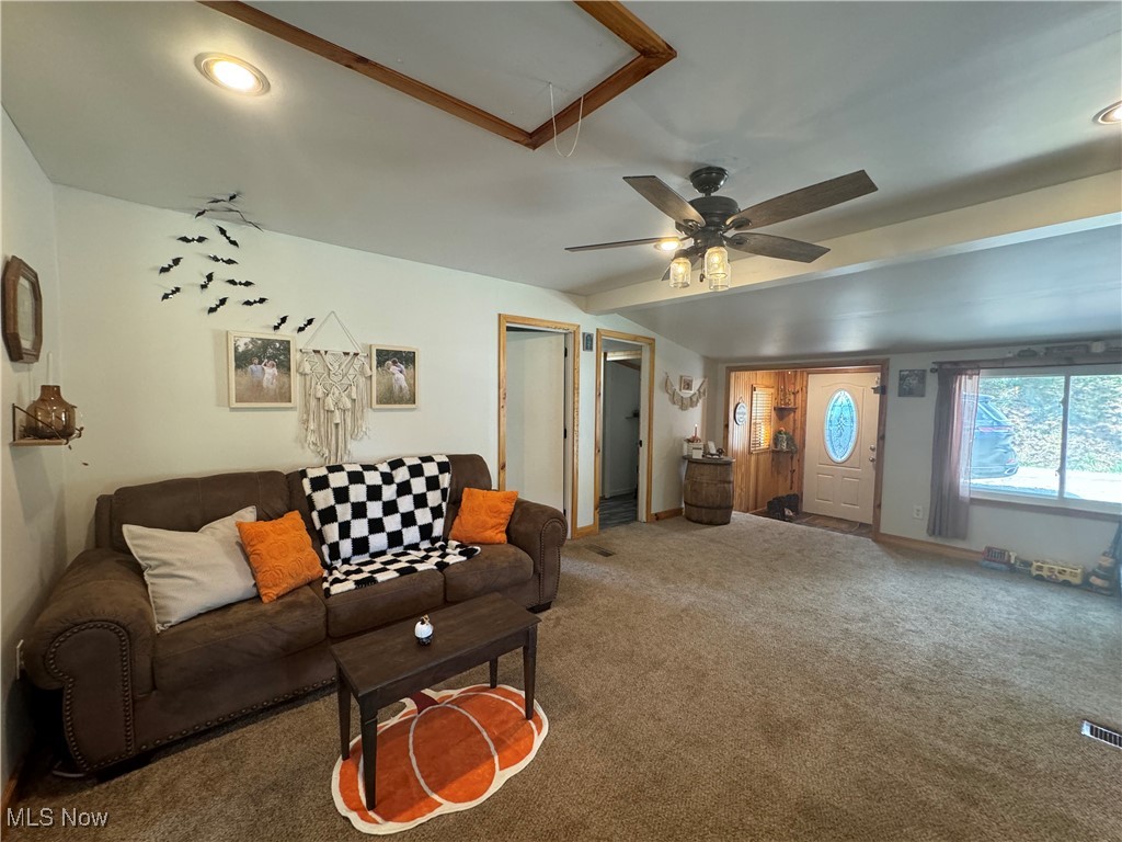 1480 Jerrys Run Road Belleville, WV 26133 - Photo 6 of 48 Carpeted living room with ceiling fan and beamed ceiling
