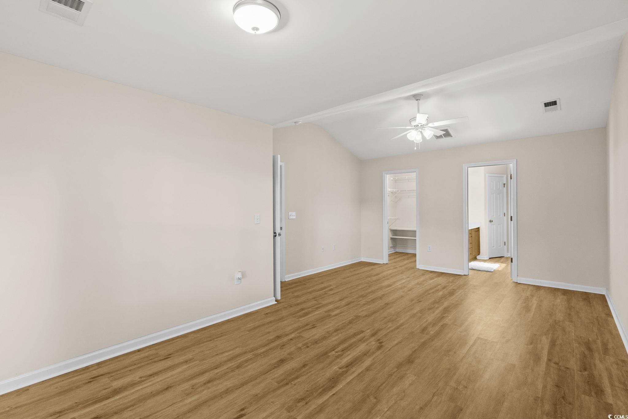 280 Barclay Drive Myrtle Beach, SC 29579 - Photo 24 of 38 Primary bedroom with light LVP flooring and ceiling fan