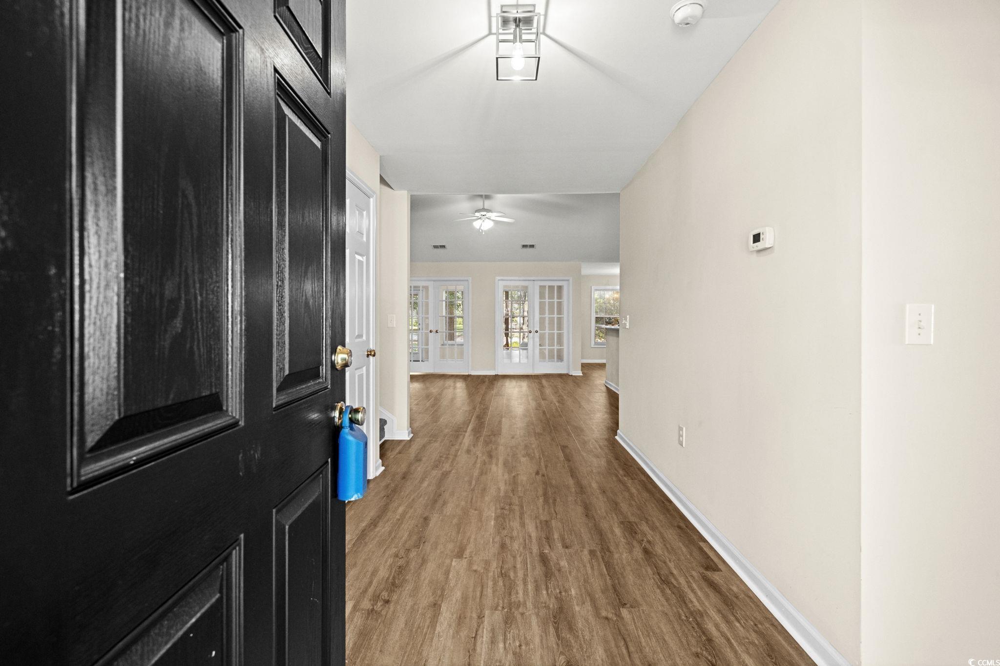 280 Barclay Drive Myrtle Beach, SC 29579 - Photo 3 of 38 Entrance foyer with dark wood finished floors and baseboards