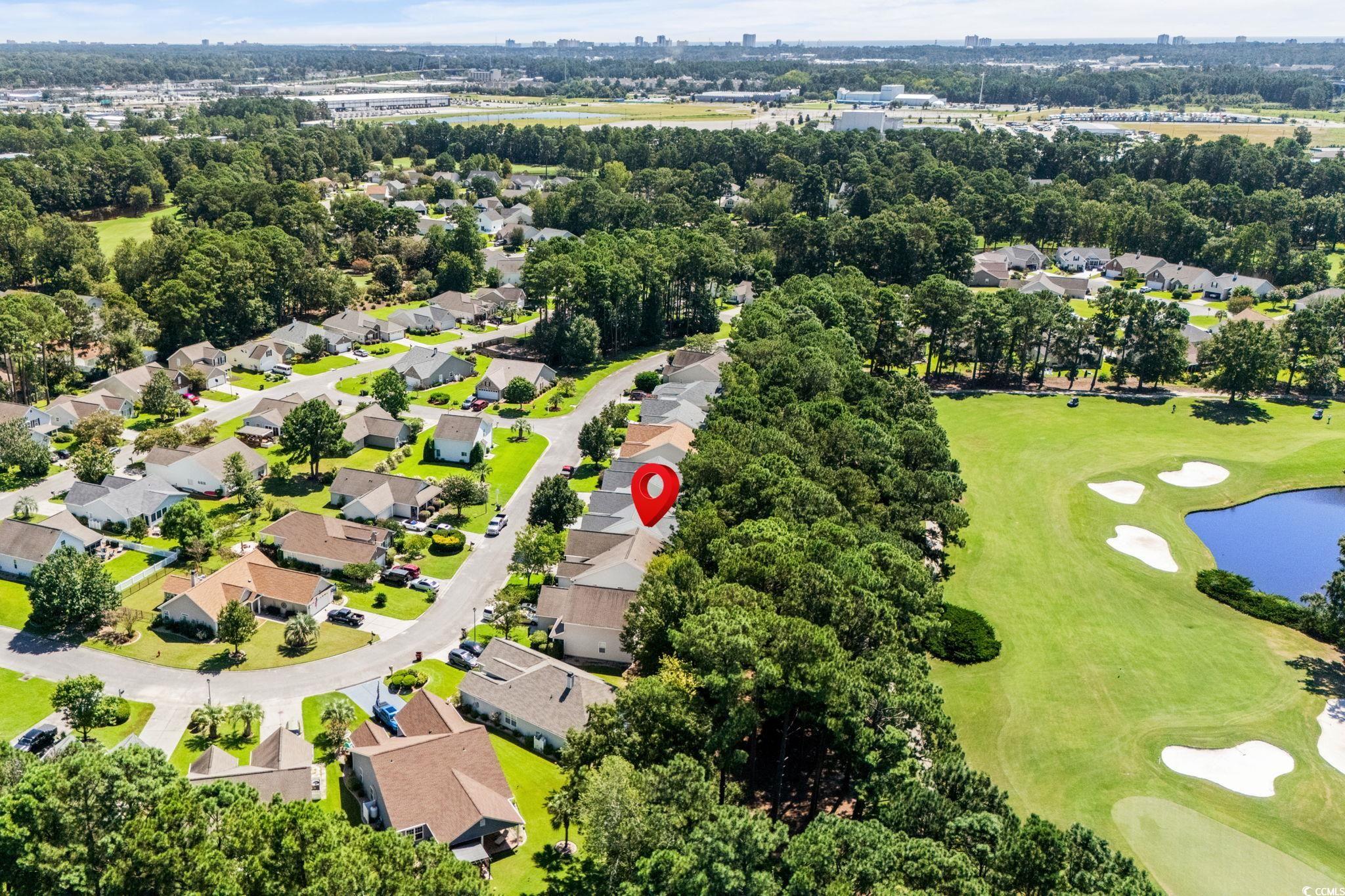 280 Barclay Drive Myrtle Beach, SC 29579 - Photo 36 of 38 Aerial view of residential area featuring a golf club and a large body of water