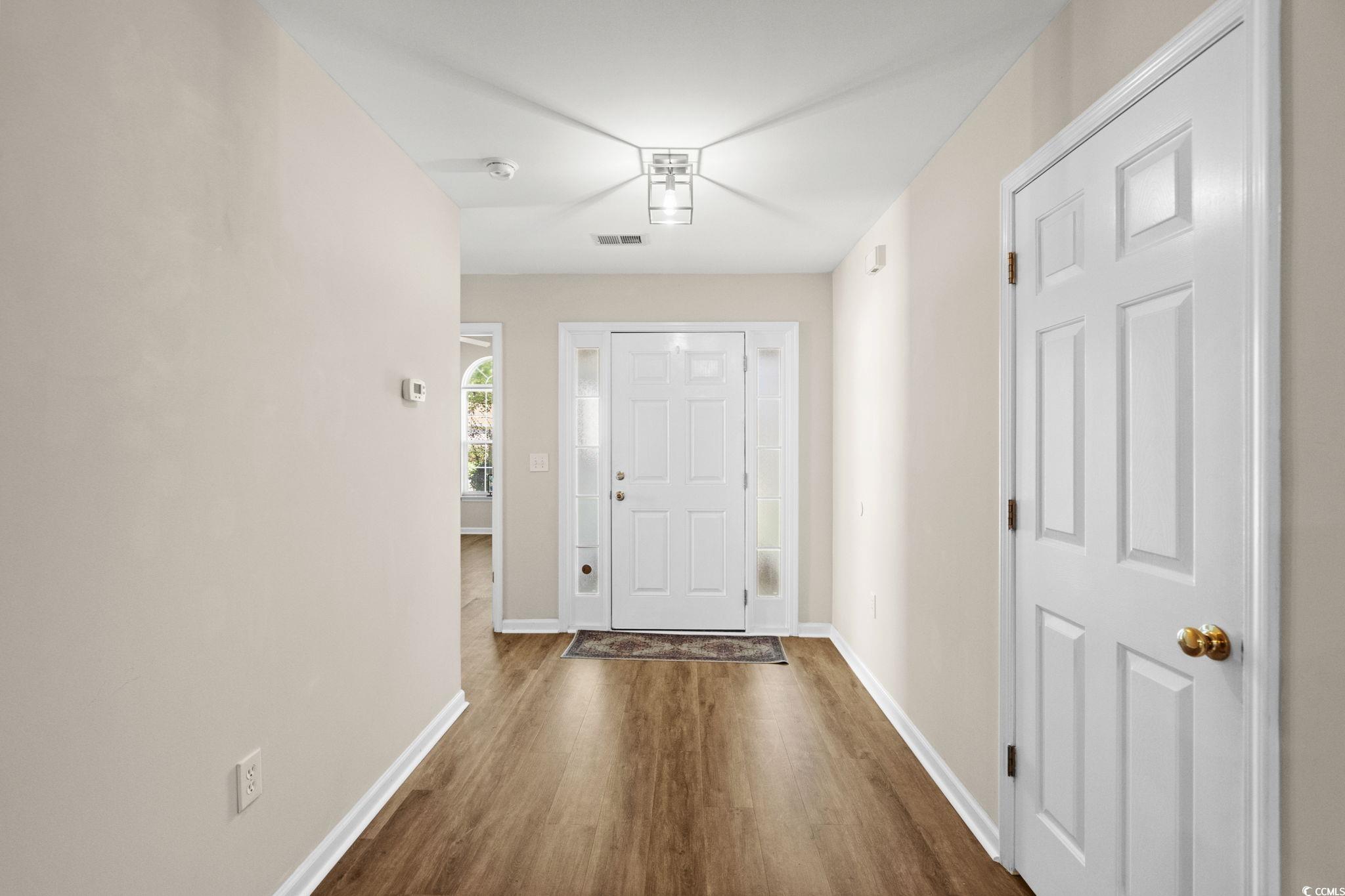 280 Barclay Drive Myrtle Beach, SC 29579 - Photo 4 of 38 Entrance foyer with baseboards and dark wood-style floors