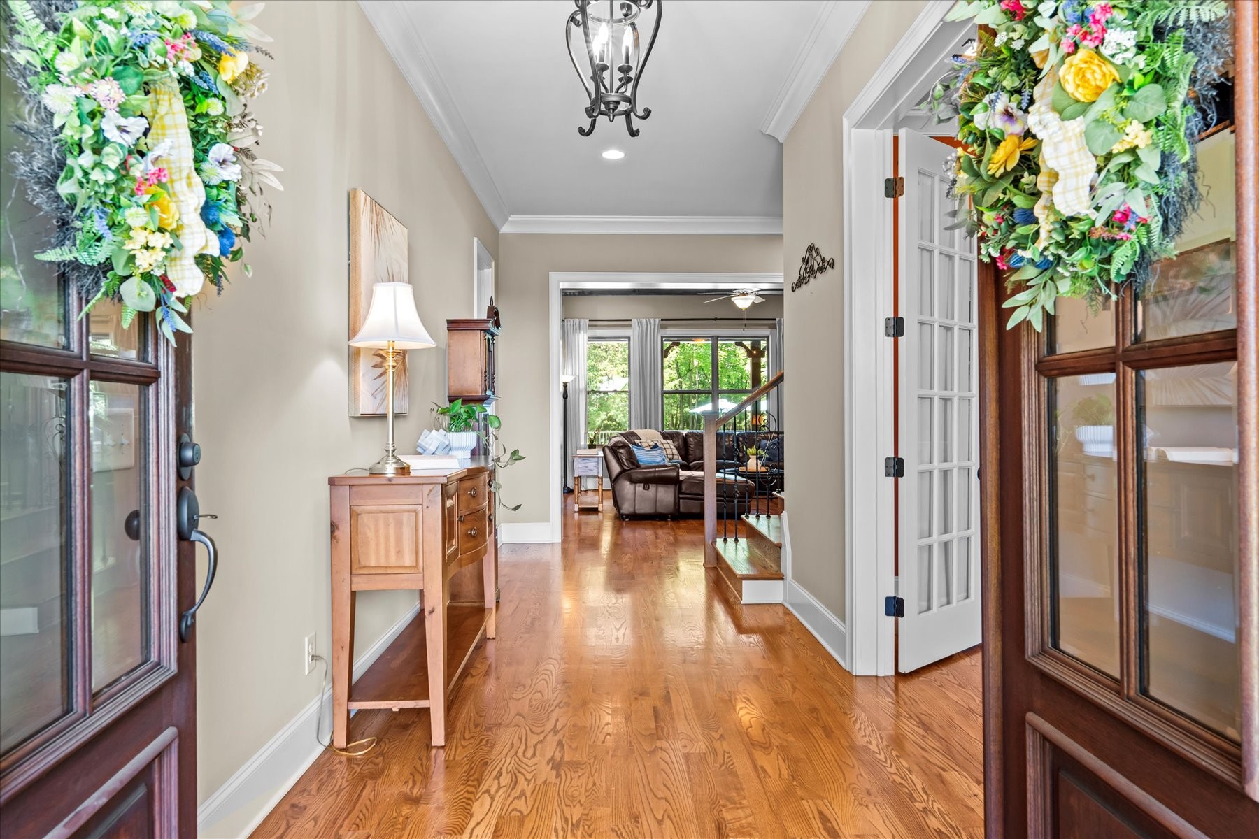 8311 Saundersville Road Mount Juliet, TN 37122 - Photo 16 of 70 a hallway with a dining table and a potted plant