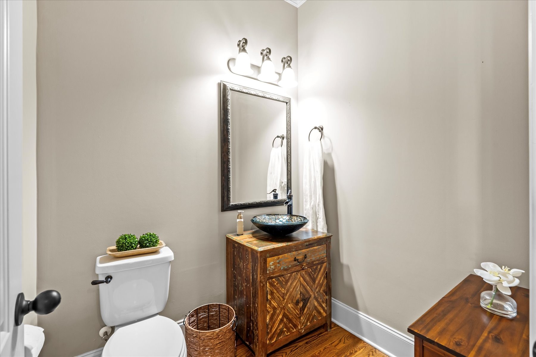 8311 Saundersville Road Mount Juliet, TN 37122 - Photo 20 of 70 a bathroom with a toilet a sink and mirror