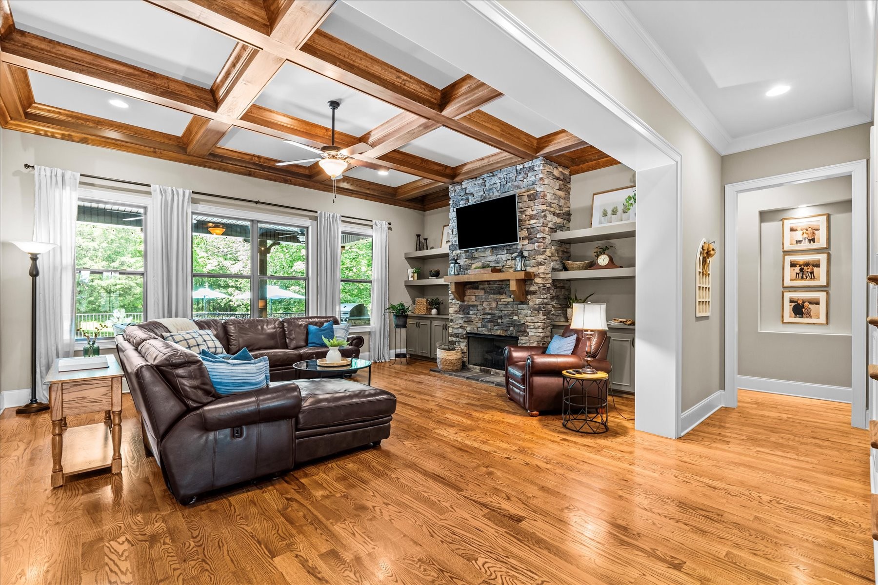 8311 Saundersville Road Mount Juliet, TN 37122 - Photo 21 of 70 a living room with furniture a fireplace and a flat screen tv