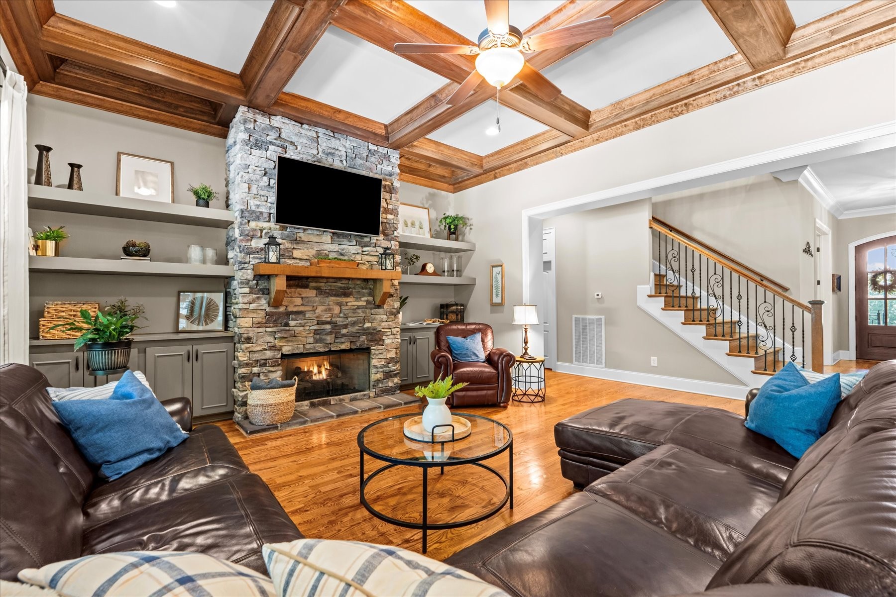 8311 Saundersville Road Mount Juliet, TN 37122 - Photo 23 of 70 a living room with furniture a flat screen tv and a fireplace