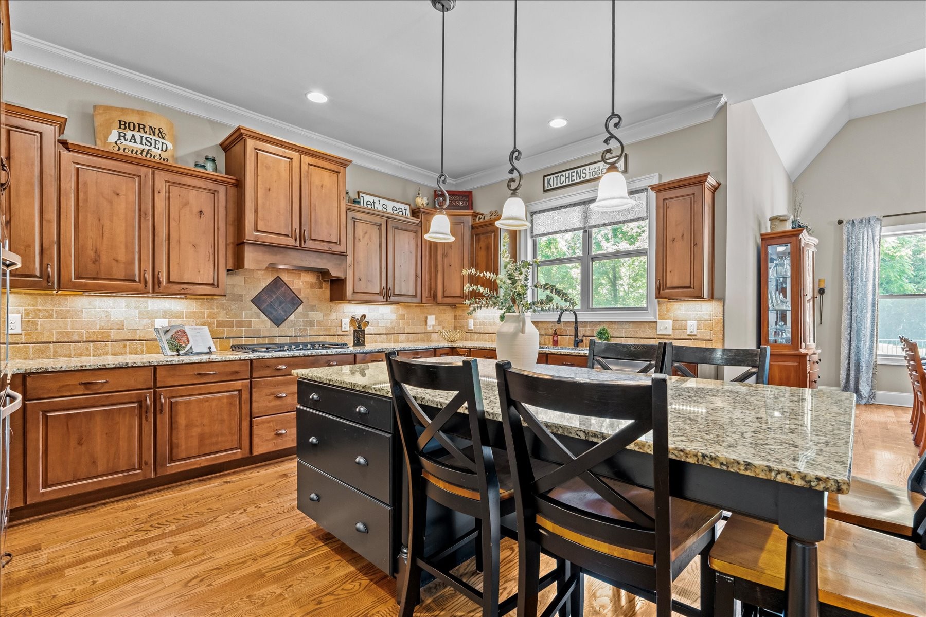 8311 Saundersville Road Mount Juliet, TN 37122 - Photo 28 of 70 a kitchen with granite countertop a table chairs sink and cabinets