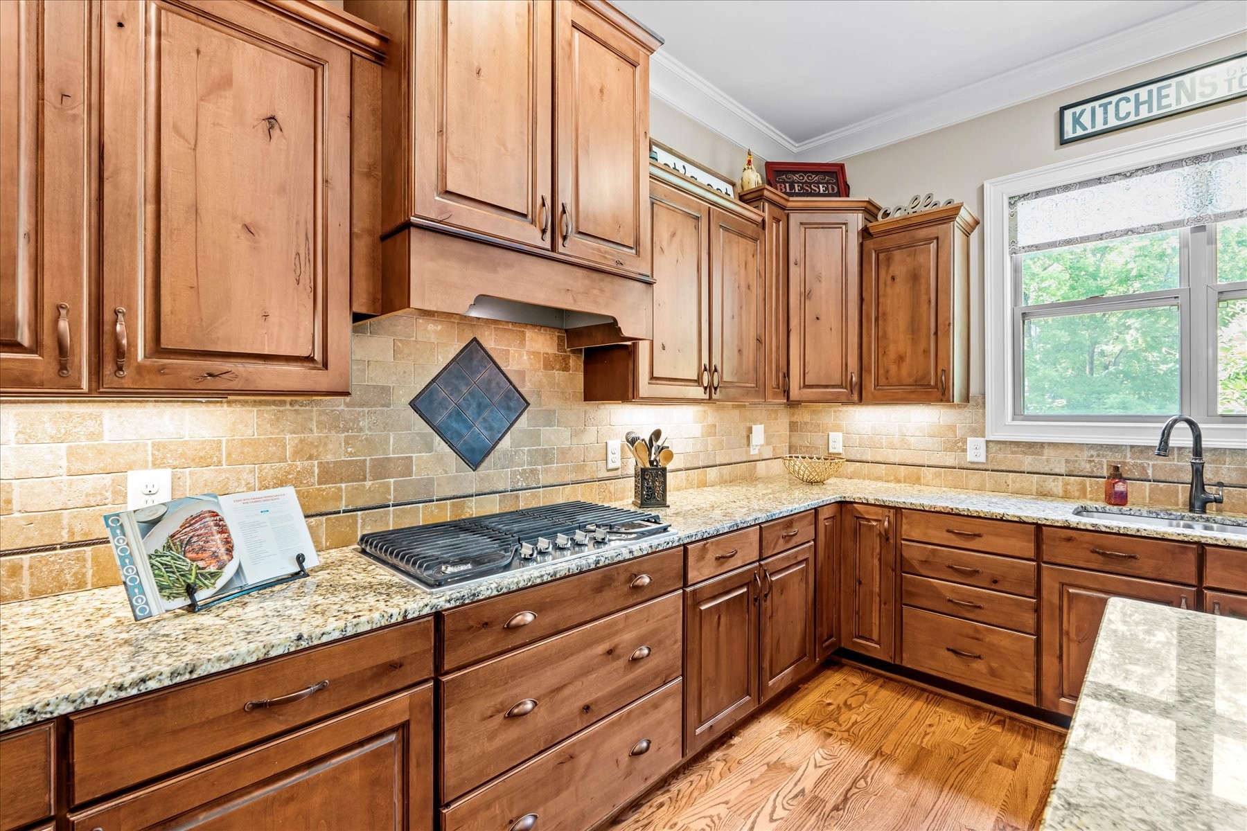 8311 Saundersville Road Mount Juliet, TN 37122 - Photo 29 of 70 a kitchen with stainless steel appliances granite countertop a sink a stove and cabinets