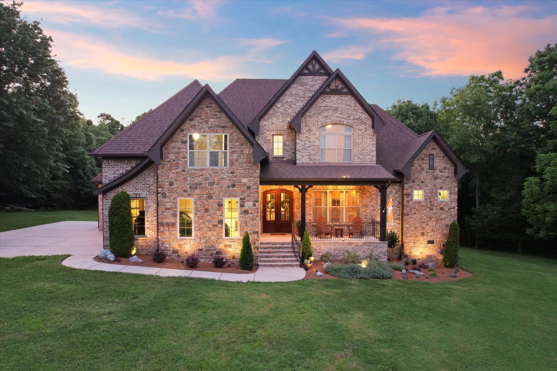 8311 Saundersville Road Mount Juliet, TN 37122 - Photo 3 of 70 a front view of a house with a yard