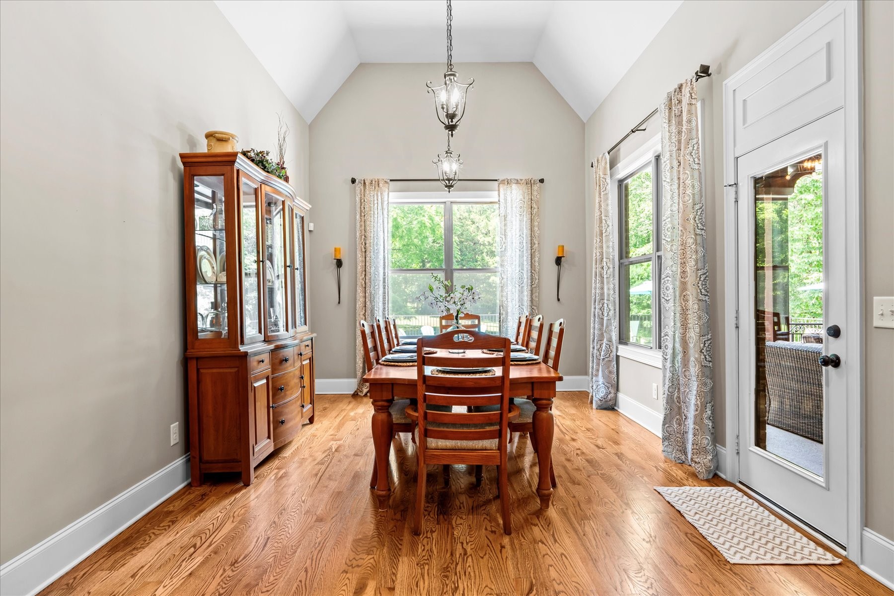 8311 Saundersville Road Mount Juliet, TN 37122 - Photo 31 of 70 a dining room with furniture wooden floor a chandelier