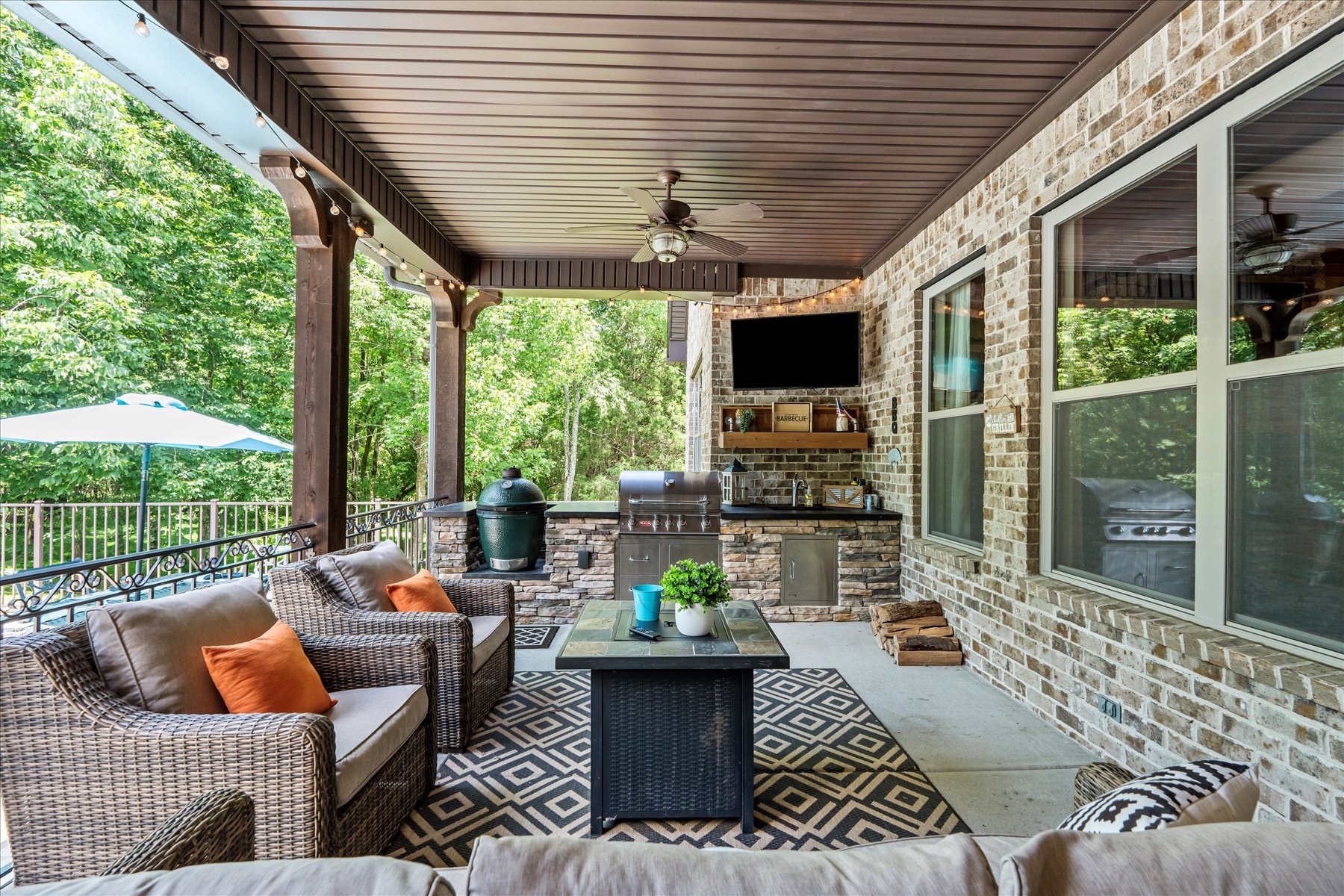 8311 Saundersville Road Mount Juliet, TN 37122 - Photo 33 of 70 a living room with patio furniture and a floor to ceiling window