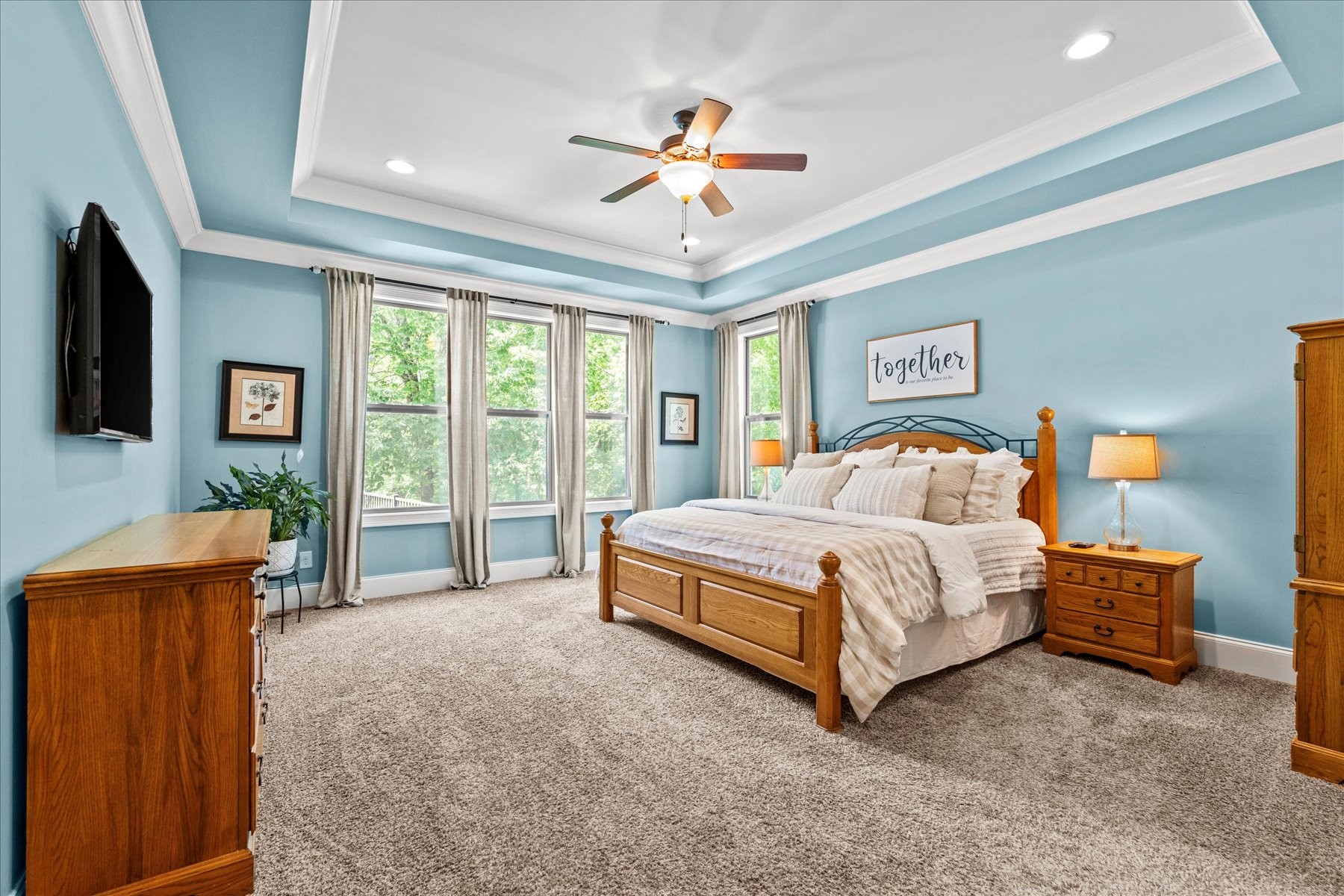 8311 Saundersville Road Mount Juliet, TN 37122 - Photo 42 of 70 a bedroom with a bed and a chandelier