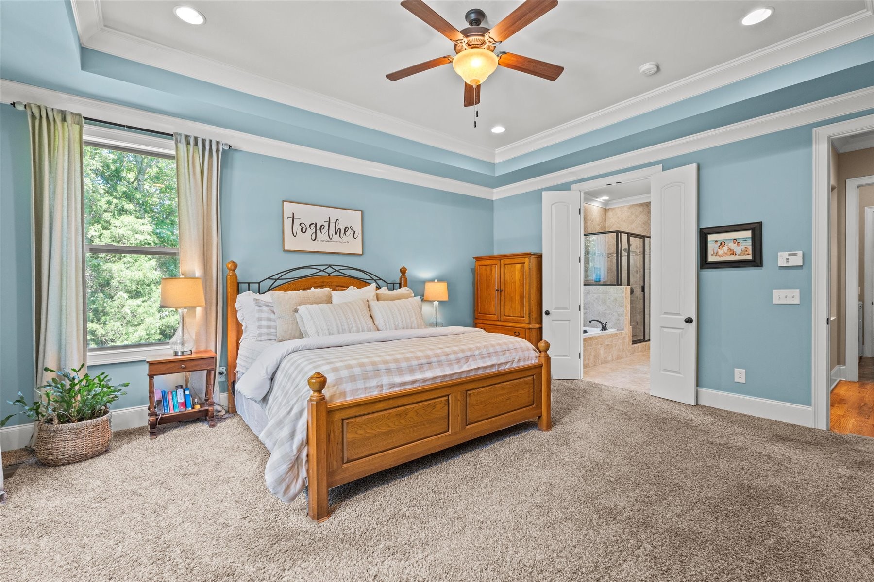 8311 Saundersville Road Mount Juliet, TN 37122 - Photo 43 of 70 a bedroom with a bed and a chandelier
