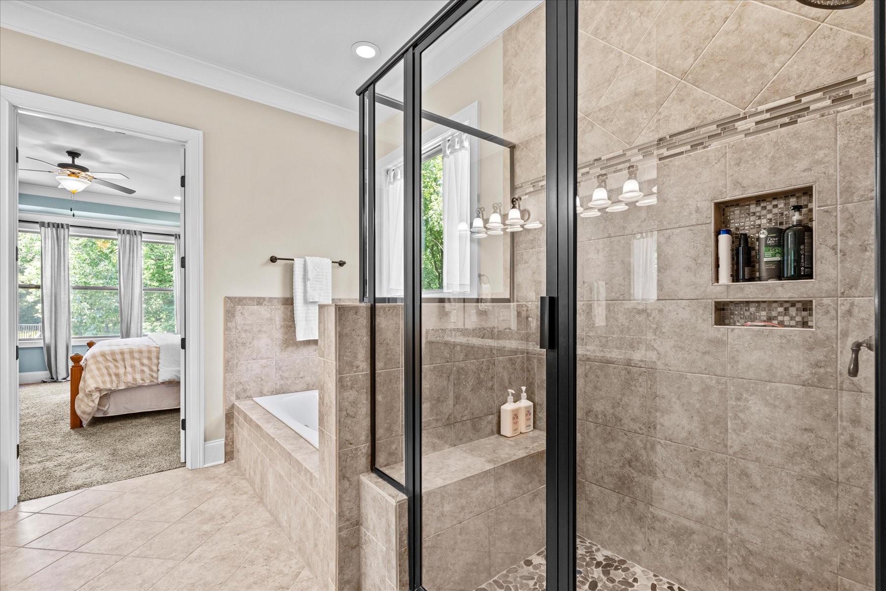 8311 Saundersville Road Mount Juliet, TN 37122 - Photo 46 of 70 a en suite bathroom with a tub shower and mirror