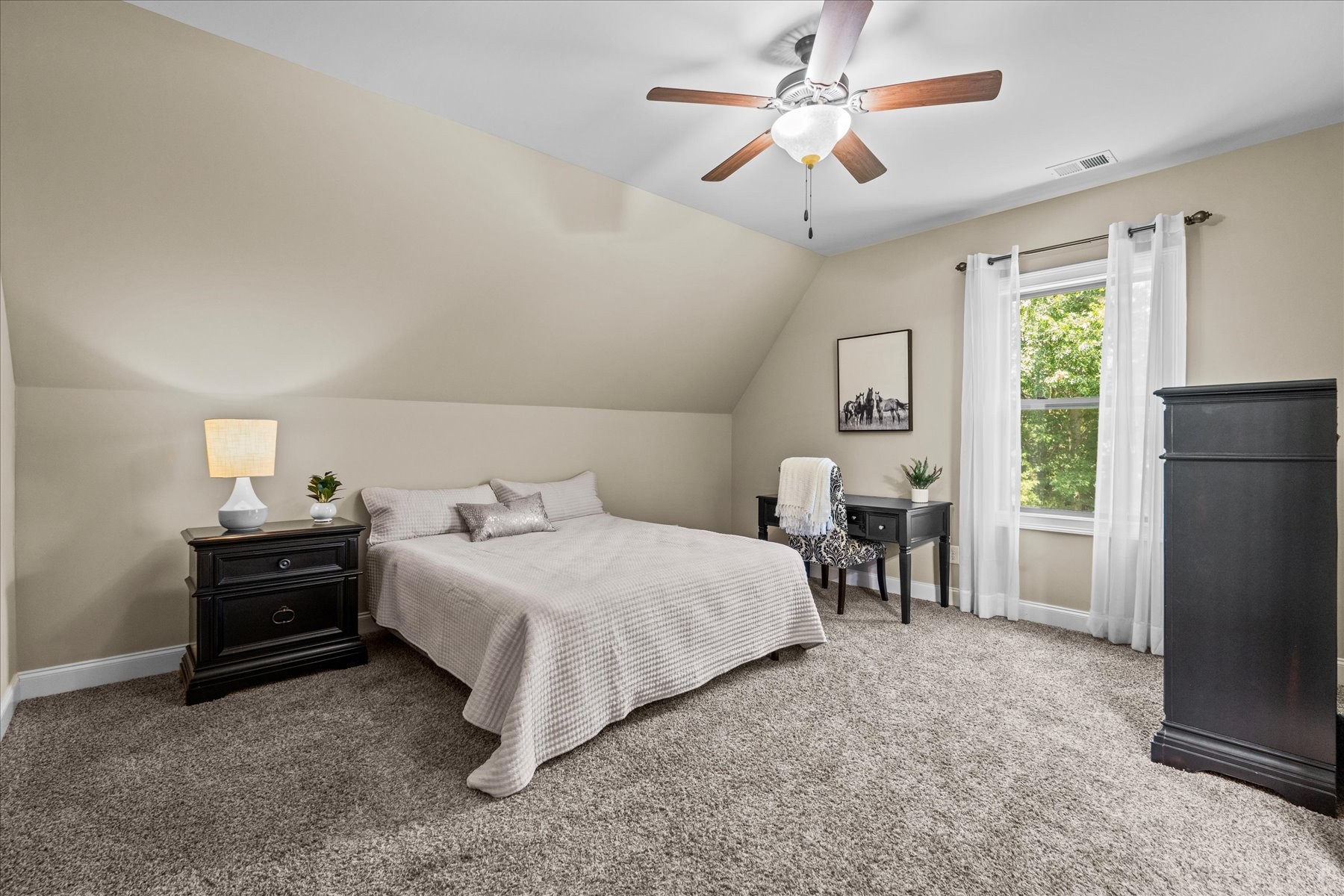 8311 Saundersville Road Mount Juliet, TN 37122 - Photo 50 of 70 a bedroom with bed and a chandelier