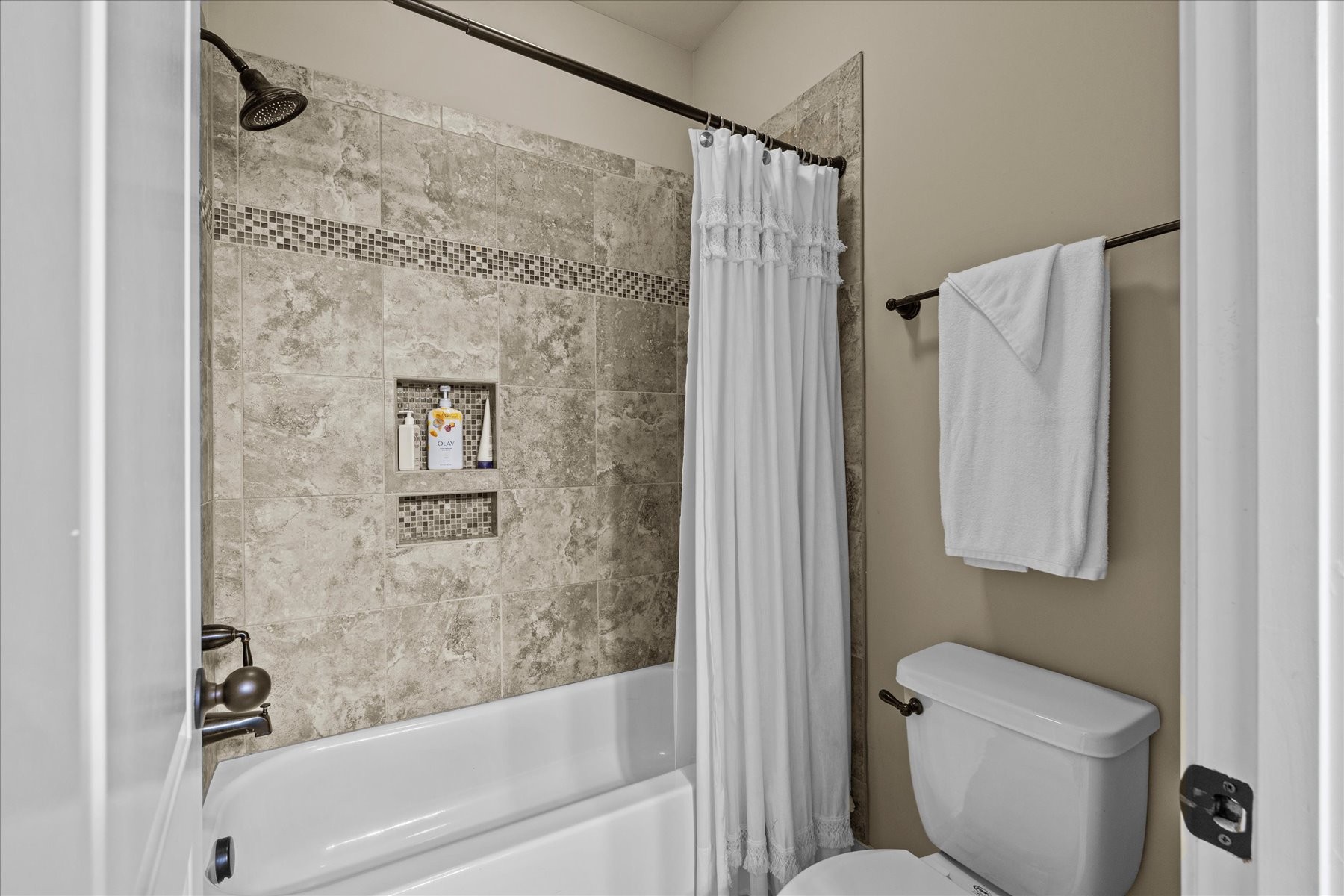 8311 Saundersville Road Mount Juliet, TN 37122 - Photo 52 of 70 a bathroom with a shower a toilet and a shower