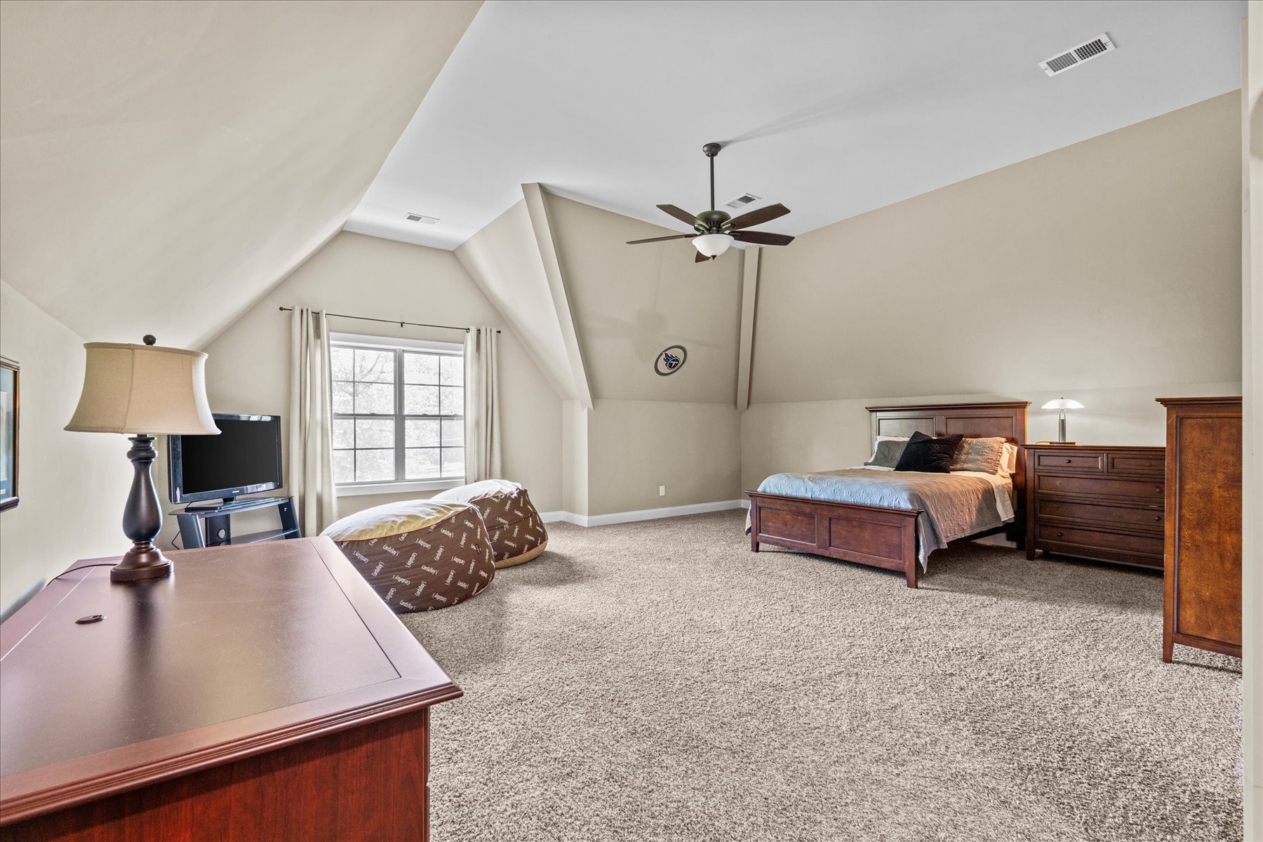 8311 Saundersville Road Mount Juliet, TN 37122 - Photo 60 of 70 a bedroom with furniture and a window