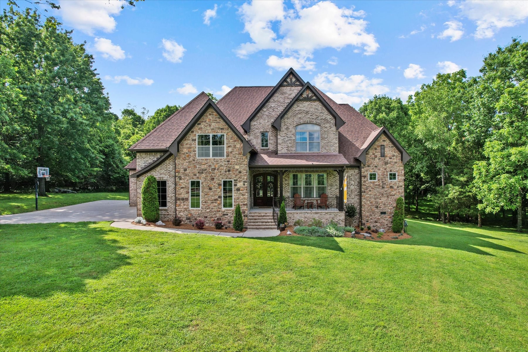8311 Saundersville Road Mount Juliet, TN 37122 - Photo 9 of 70 a front view of a house with a yard