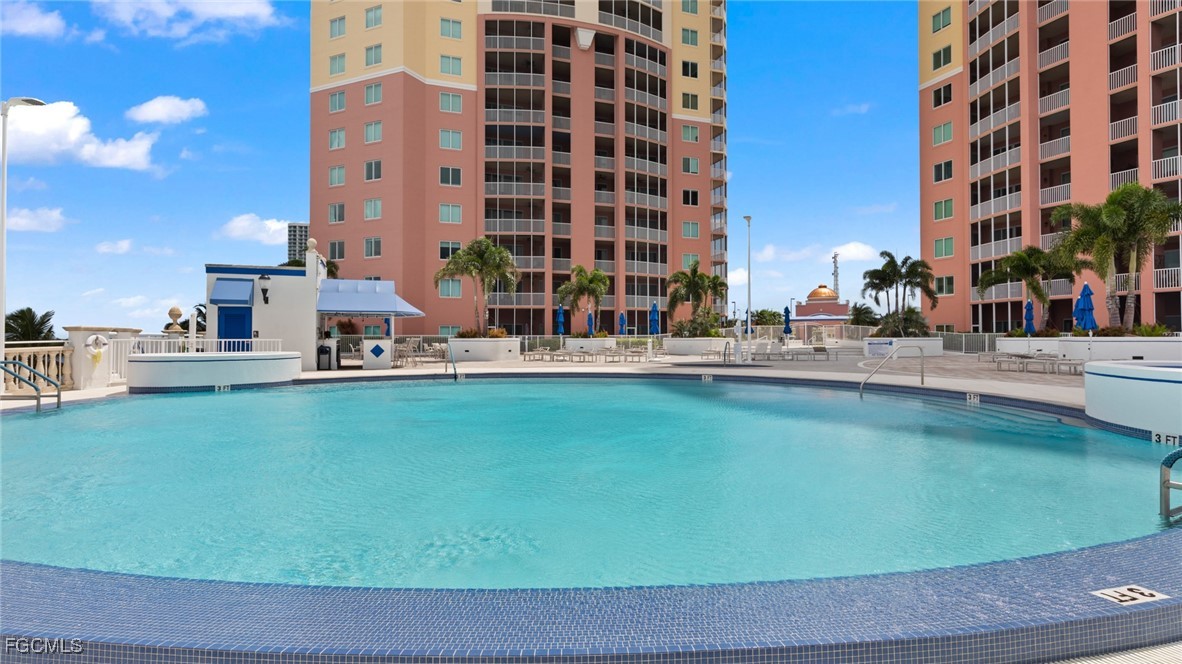 2743 First Street, Unit 104 Fort Myers, FL 33916 - Photo 27 of 32 a terrace with outdoor seating and city view