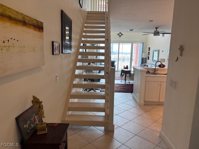 2743 First Street, Unit 104 Fort Myers, FL 33916 - Photo 4 of 32 a kitchen with stainless steel appliances kitchen island granite countertop a refrigerator and a sink